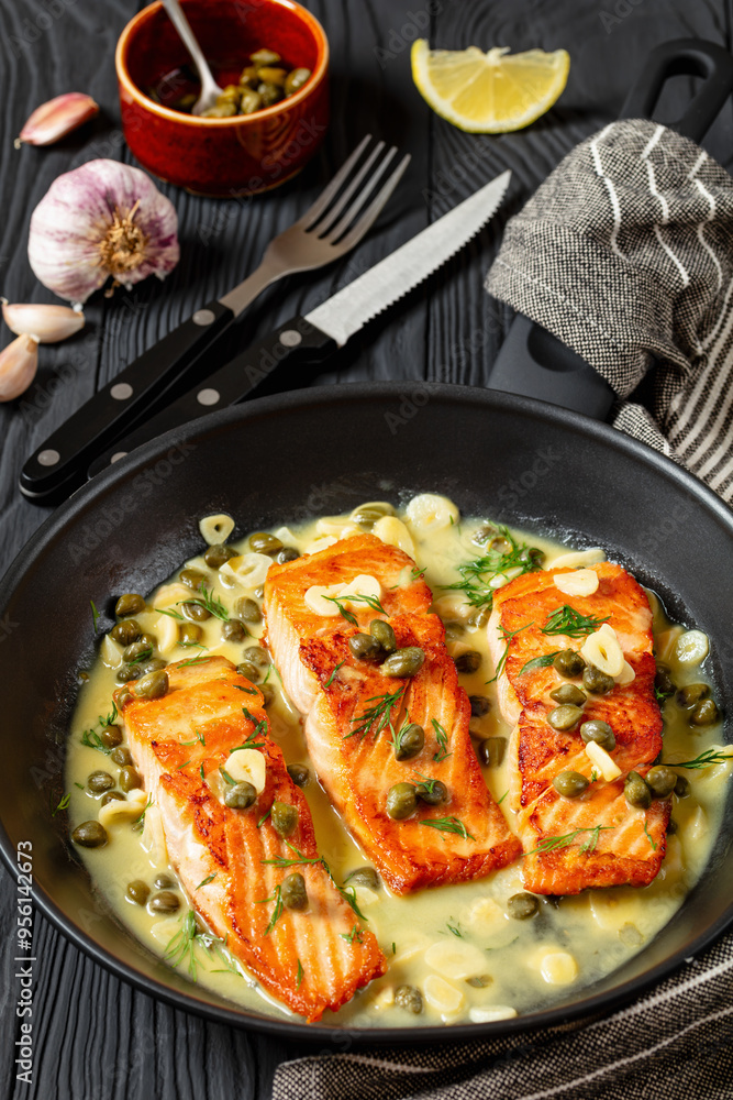 salmon piccata with lemon caper sauce in a pan salmon piccata with lemon caper sauce in a pan