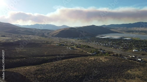  Pan right over wildfire smoke plume in the sky from Stead Nevada. Bear fire, Loyalton California photo