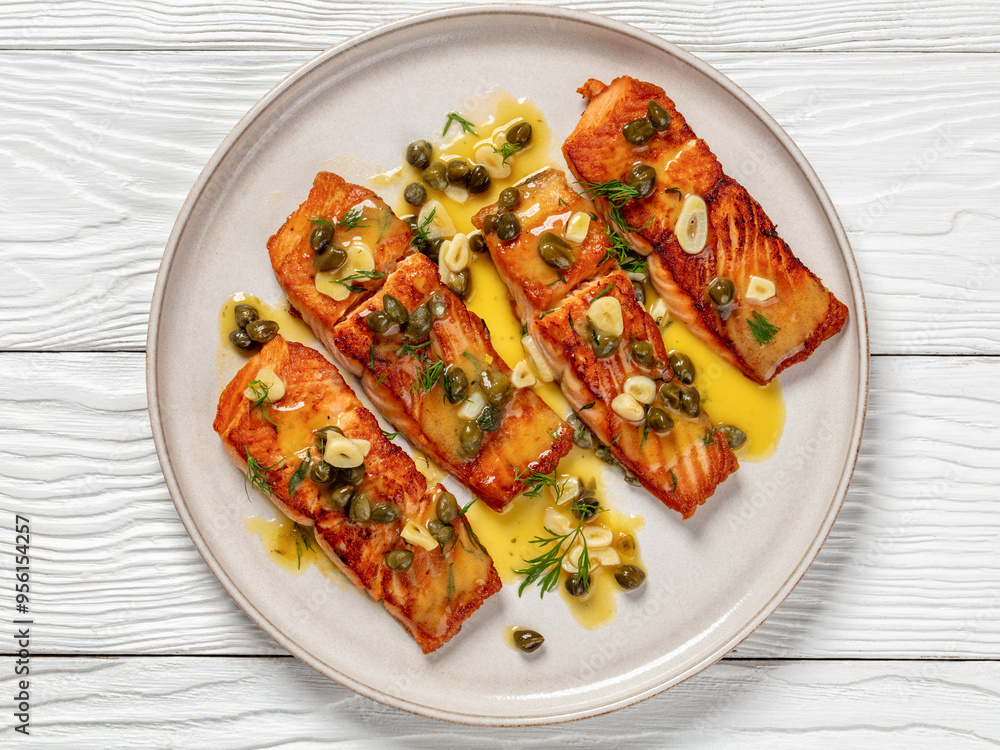 salmon piccata with lemon caper sauce on plate salmon piccata with lemon caper sauce on plate