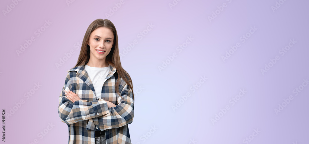 Woman smiling with arms crossed, wearing a plaid shirt over a white top, standing against a pastel gradient background, symbolizing confidence and contentment Woman smiling with arms crossed, wearing a plaid shirt over a white top, standing against a pastel gradient background, symbolizing confidence and contentment