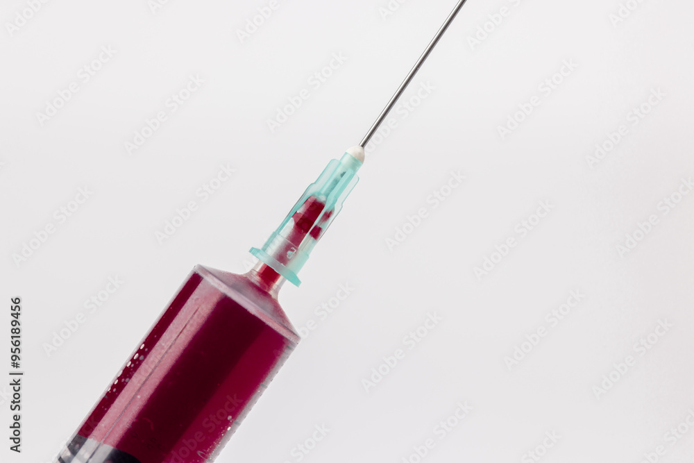 Syringe with Blood Tilted on White Background Horizontal Image Syringe with Blood Tilted on White Background Horizontal Image