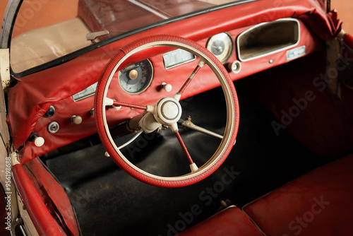 Photo of the interior of an old car. steering wheel