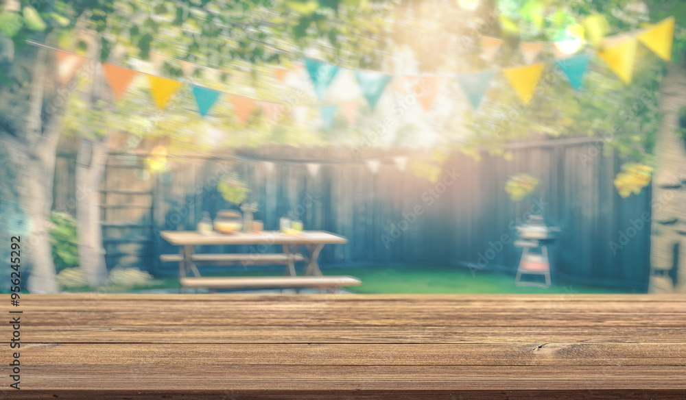 Obraz premium summer time party in backyard garden with grill BBQ, wooden table, blurred background