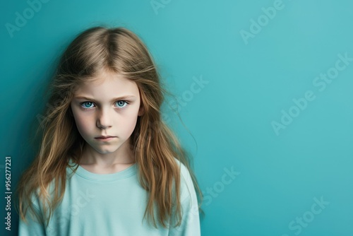 Cyan background sad European white child realistic person portrait of young beautiful bad mood expression child Isolated on Background depression anxiety fear burn out 