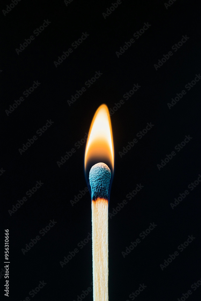 A lit matchstick glowing brightly against dark background, showcasing its flame and striking head. image captures essence of light in darkness. A lit matchstick glowing brightly against dark background, showcasing its flame and striking head. image captures essence of light in darkness.