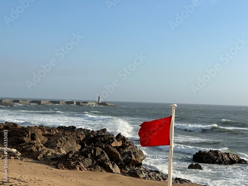 Red flag , on the ocean , during storm weather .