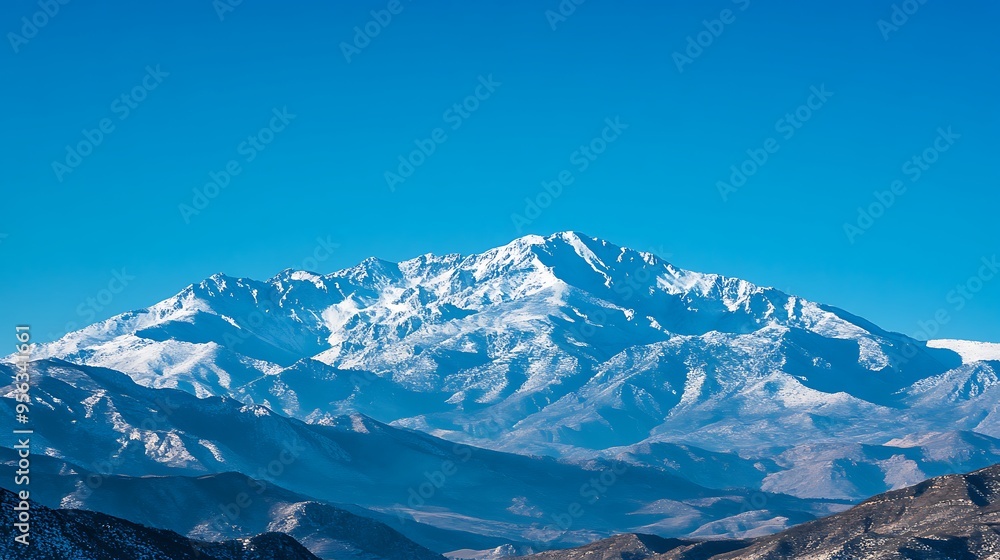 Majestic Snowy Mountain Peak in a Clear Blue Sky Majestic Snowy Mountain Peak in a Clear Blue Sky