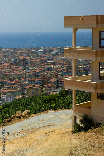 View of the city of Alanya with a view of an abandoned building, Turkey.