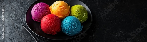 Vibrant Scoops of Colorful Ice Cream in Black Bowl on Dark Background - Rainbow Dessert Treats