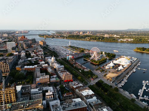 Drone view of Old Port City waterfront park with an entertainment venue and Jacques Cartier Bridge in the background. Montreal, Canada. photo