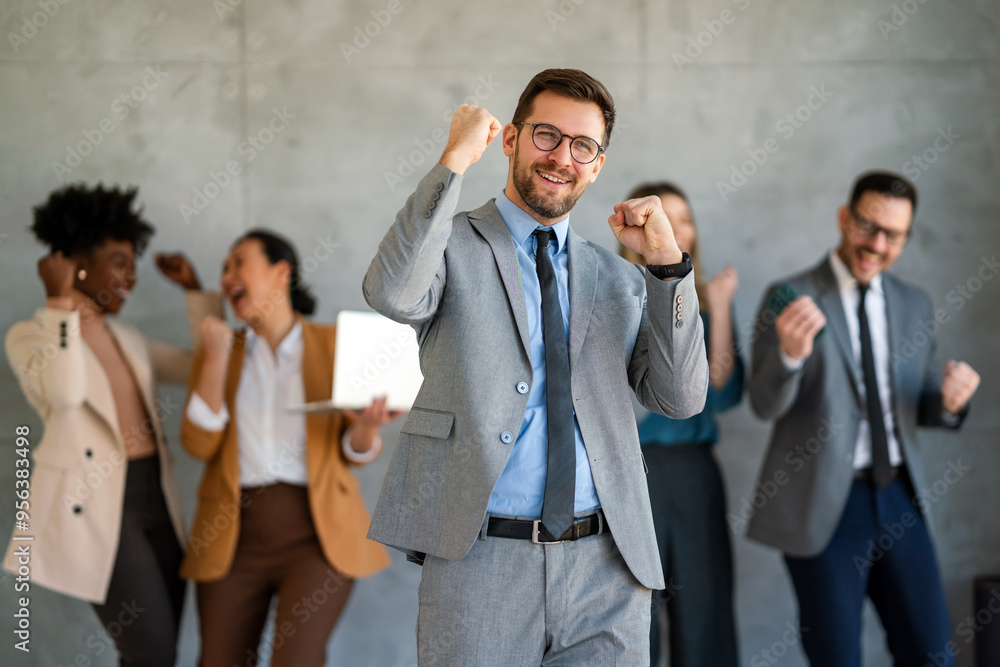 Excited overjoyed diverse business people, team celebrate corporate victory together in office Excited overjoyed diverse business people, team celebrate corporate victory together in office