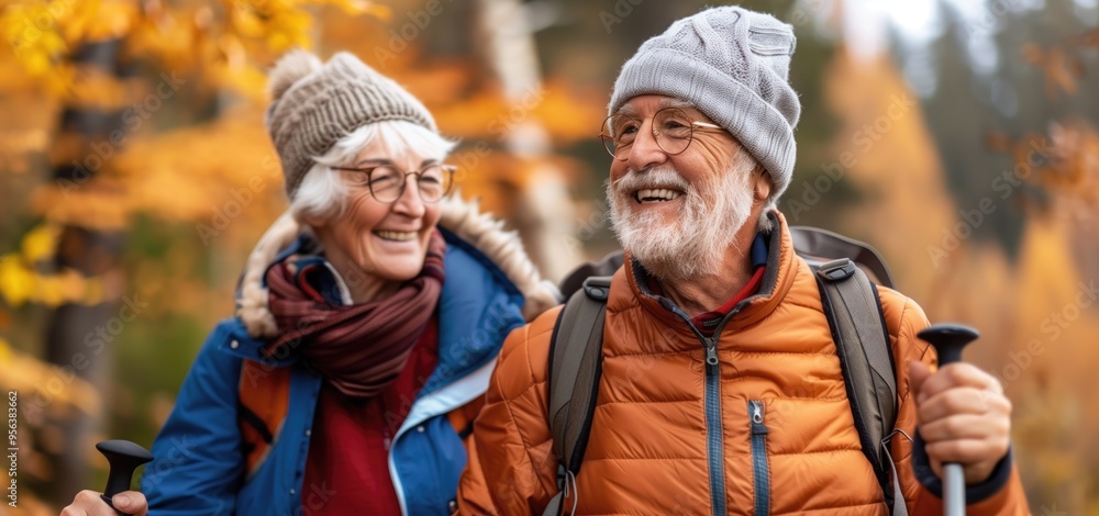 Cheerful elderly couple hiking in autumn forest. Cheerful elderly couple hiking in autumn forest.