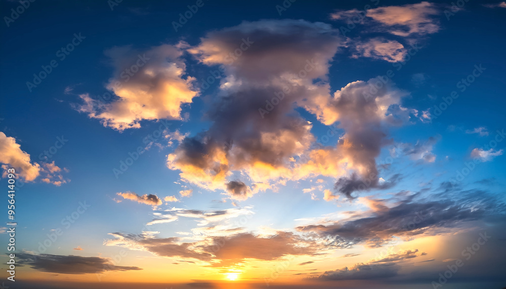 Sunset sky with a few clouds. The sky is very bright and the clouds are scattered throughout Sunset sky with a few clouds. The sky is very bright and the clouds are scattered throughout