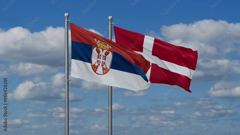 Denmark and Serbia flags flying together, video concept of the relationship, two country relations concept Denmark and Serbia flags flying together, video concept of the relationship, two country relations concept