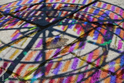 Vibrant Multicolored Shadows and Reflections on Urban Pavement