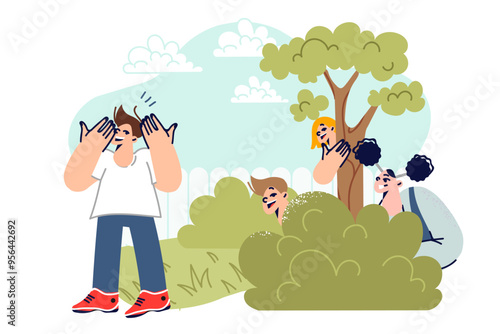 Children play hide and seek in street and laugh, enjoying opportunity to relax in fresh air