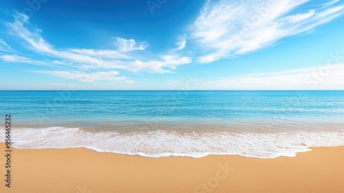 a calm beach with gentle waves lapping at the shore, evoking a sense of relaxation and tranquility
