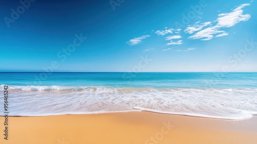 a calm beach with gentle waves lapping at the shore, evoking a sense of relaxation and tranquility