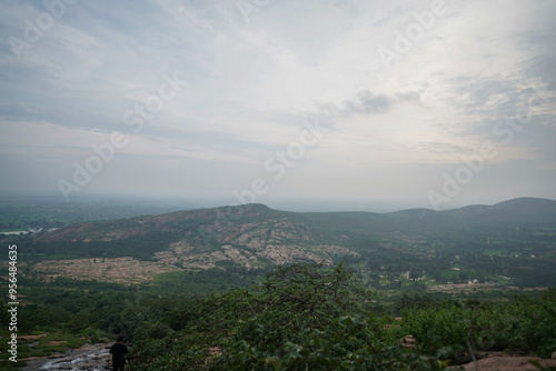 Aerial View of a Vast Landscape, Panoramic View of a Distant Valley, Scenic Landscape at Sunset Time, Misty Mountains and Rolling Hills Stock Photo.