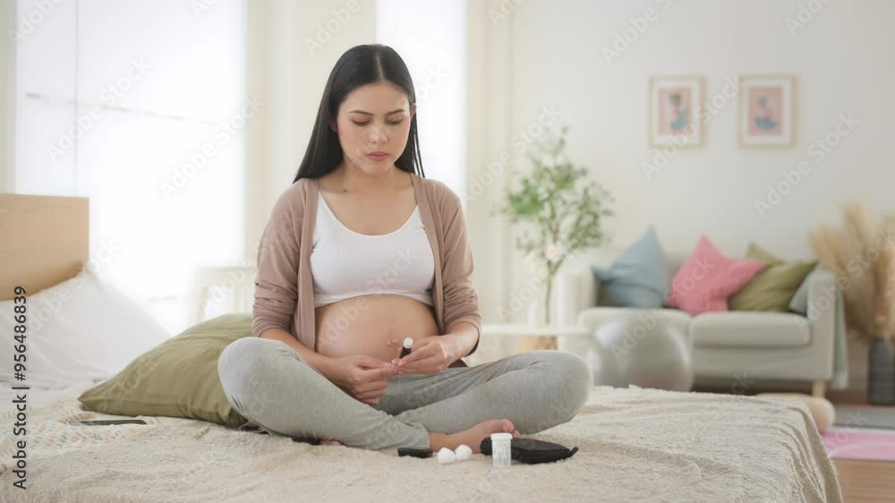 Pregnant woman checking blood sugar level by using Digital Glucose meter Pregnant woman checking blood sugar level by using Digital Glucose meter