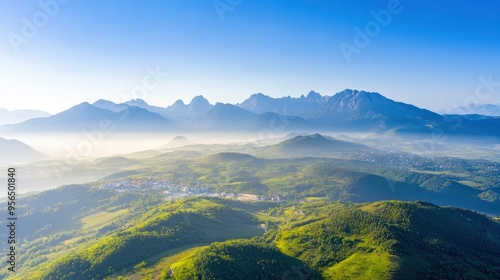 an aerial view of a mountain range on the outskirts of a city, where nature meets urban development, showcasing the contrast between rugged landscapes and modern architecture