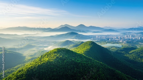 an aerial view of a mountain range on the outskirts of a city, where nature meets urban development, showcasing the contrast between rugged landscapes and modern architecture