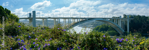 Panoramic view of the white and modern bridge over Douro (Duero) river in Porto - Ponte da Arrabida photo