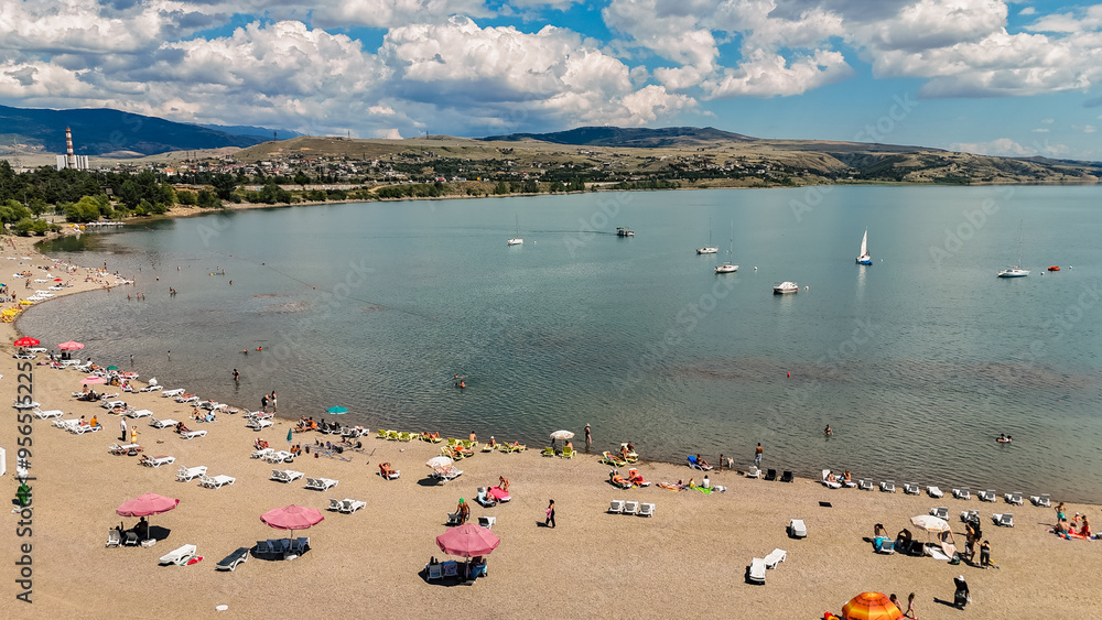 Aerial view of people relaxing on the beach. Sunbathing on the seashore. Aerial view of people relaxing on the beach. Sunbathing on the seashore.