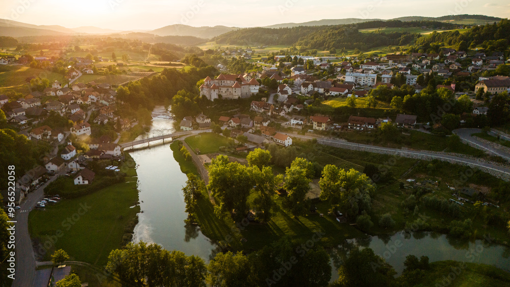 Fototapeta premium Zuzemberk Castle and medieval village on the river Krka in Slovenia. Aerial drone view