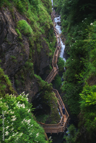 Aerial view of a wooden walkway winding through the steep, rocky cliffs of Sigmund Thun Klamm, Kaprun, Austria. photo