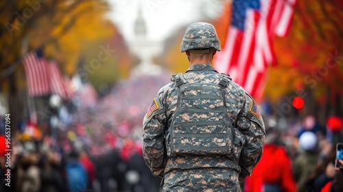 American soldier in camouflage at outdoor military parade with blurred flags and cheering crowd