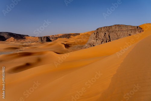 Sahara desert, sand, dunes and rocks in Algeria. Surrounding of Djanet. Place of Sahara named Moul Ennaga