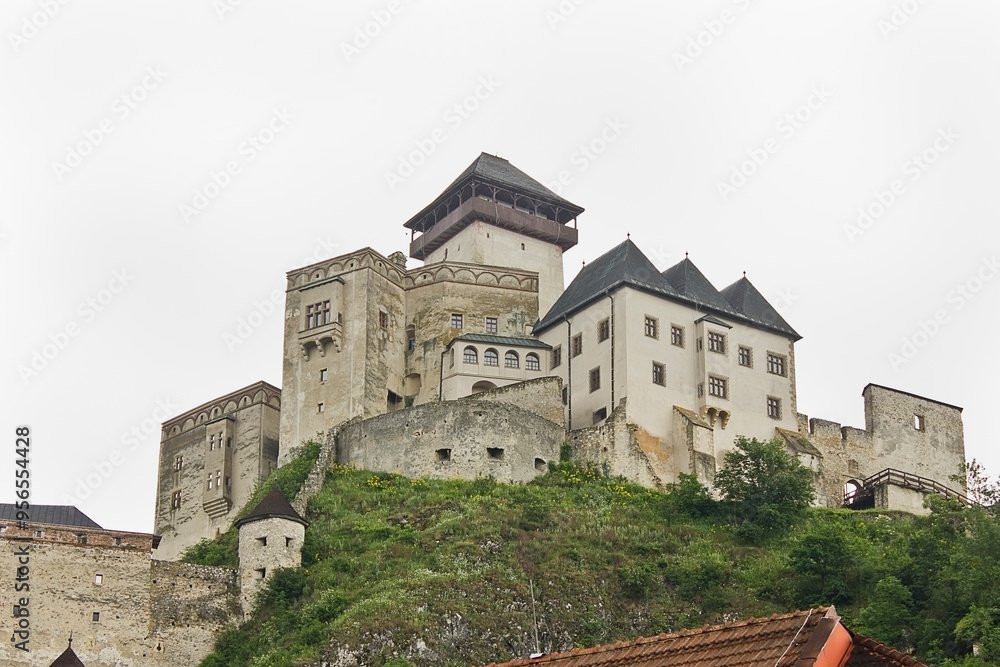 The ancient Trencin Castle from the 11th century in Slovakia. Landscape with a medieval castle on top of a mountain. The ancient Trencin Castle from the 11th century in Slovakia. Landscape with a medieval castle on top of a mountain.