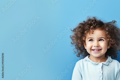 Indigo background Happy european white child realistic person portrait of young beautiful Smiling child Isolated on Background Banner with copyspace  photo