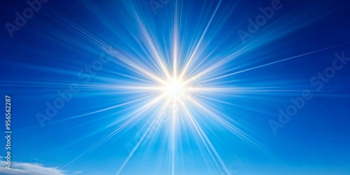 Lens flares from the sun on a blue clear sky, creating a beautiful natural background, sun, lens flares, blue sky, nature