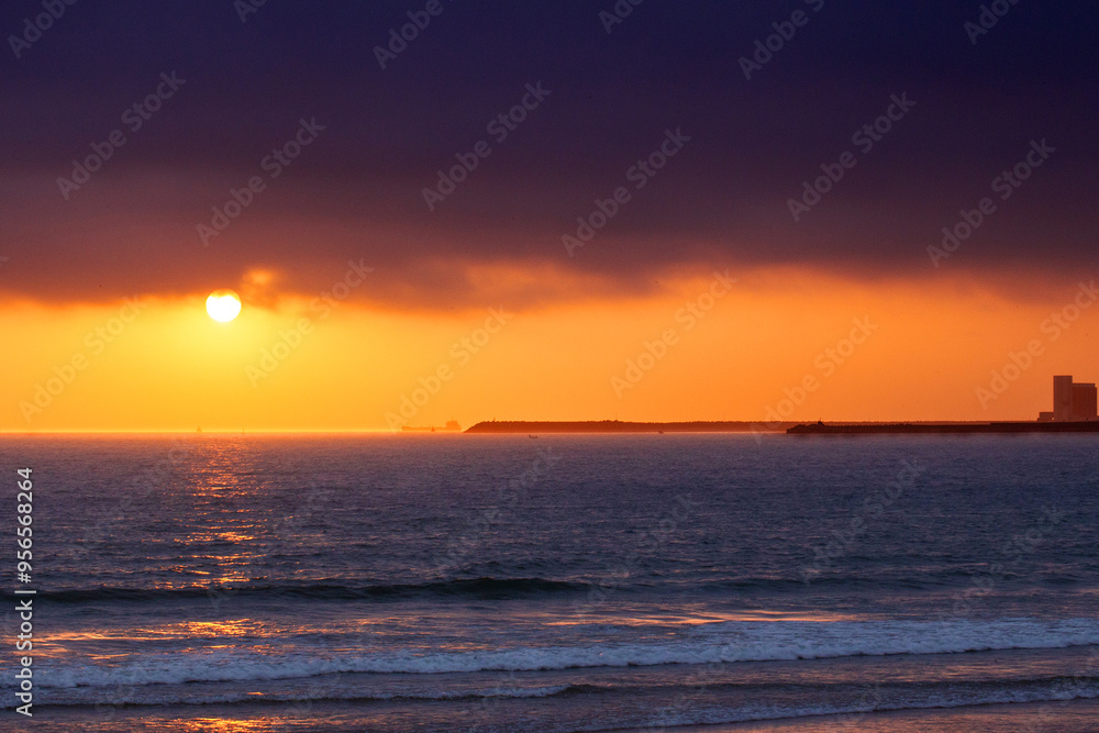 Gloomy sunset over the Atlantic Ocean. Port of Agadir. Morocco Gloomy sunset over the Atlantic Ocean. Port of Agadir. Morocco