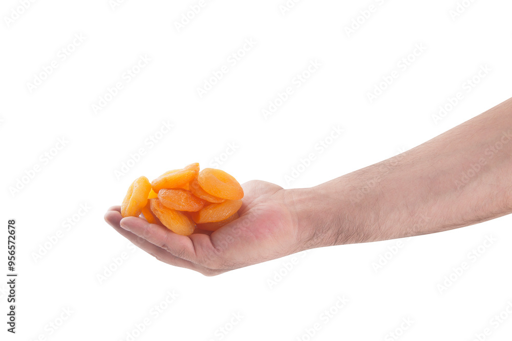 Dried Apricots in hand close-up view Dried Apricots in hand close-up view