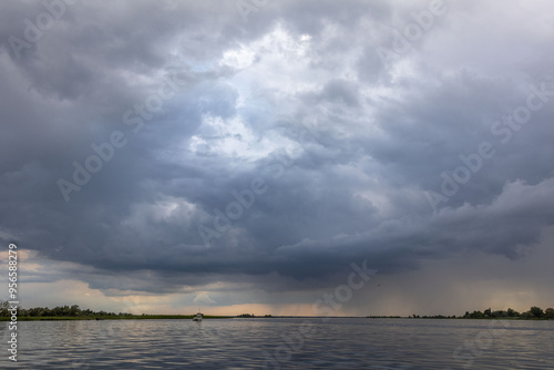 Clouds and rain over the river