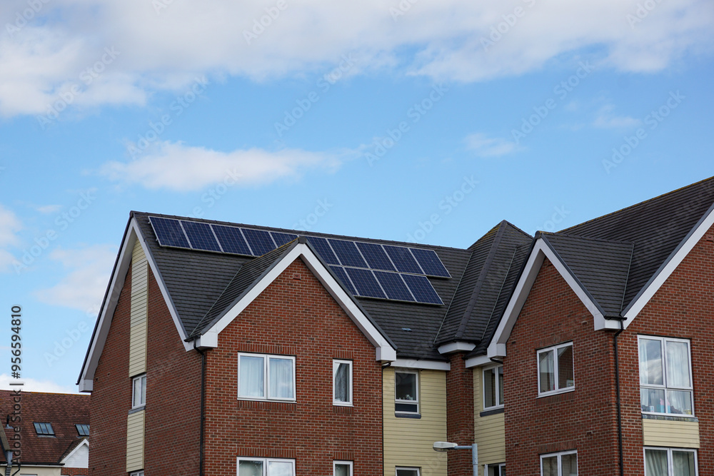 residential building roof top with solar panels. new homes with renewable energy source residential building roof top with solar panels. new homes with renewable energy source
