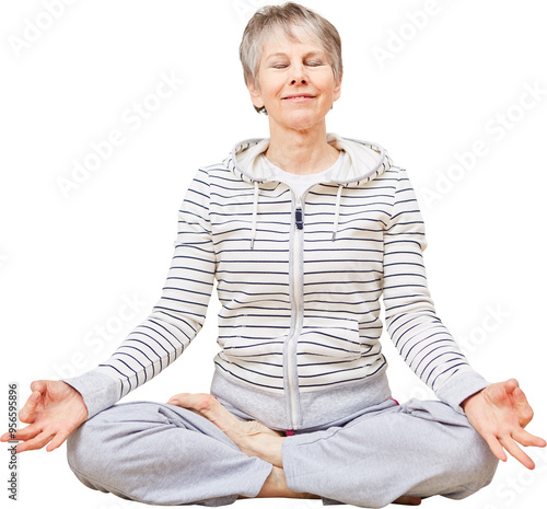 Seniorin im Lotossitz bei einer Yoga Übung photo