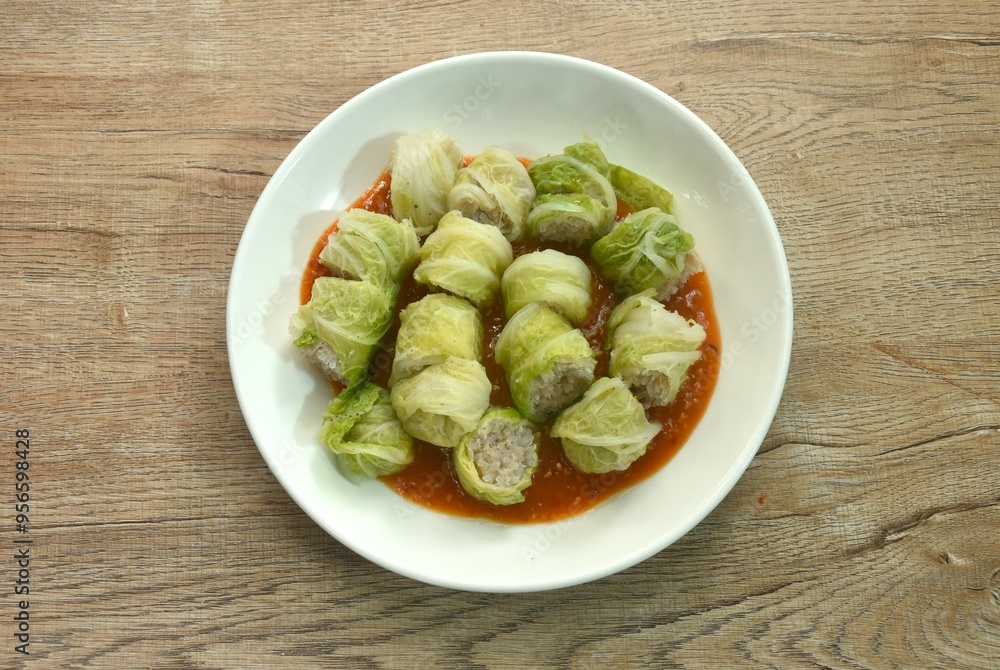 steamed Chinese cabbage sukiyaki stuffed chop pork and glass noodles on plate dressing sauce steamed Chinese cabbage sukiyaki stuffed chop pork and glass noodles on plate dressing sauce