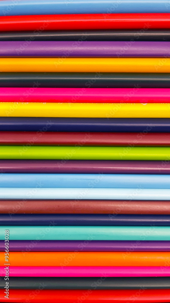 Colorful sharpened pencils are lined up on the table. Colorful sharpened pencils are lined up on the table.