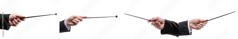 Against a white background, a hand holds a magic wand Against a white background, a hand holds a magic wand