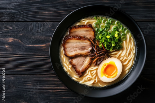 exquisite tonkotsu ramen served in black bowl on dark wooden background