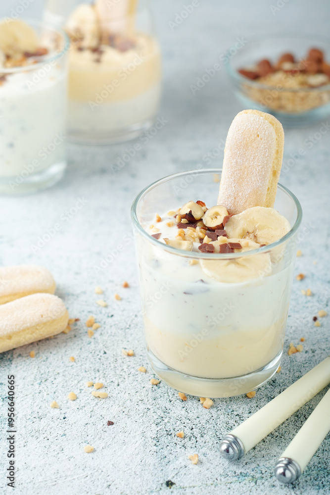 Milk mousse dessert with nuts in glasses Milk mousse dessert with nuts in glasses
