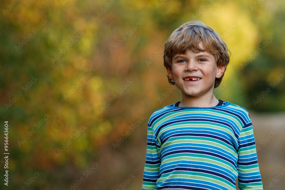 Portrait of little cool kid boy in forest. Happy healthy child having fun on warm sunny day early autumn. Family, nature, love and active leisure. Portrait of little cool kid boy in forest. Happy healthy child having fun on warm sunny day early autumn. Family, nature, love and active leisure.