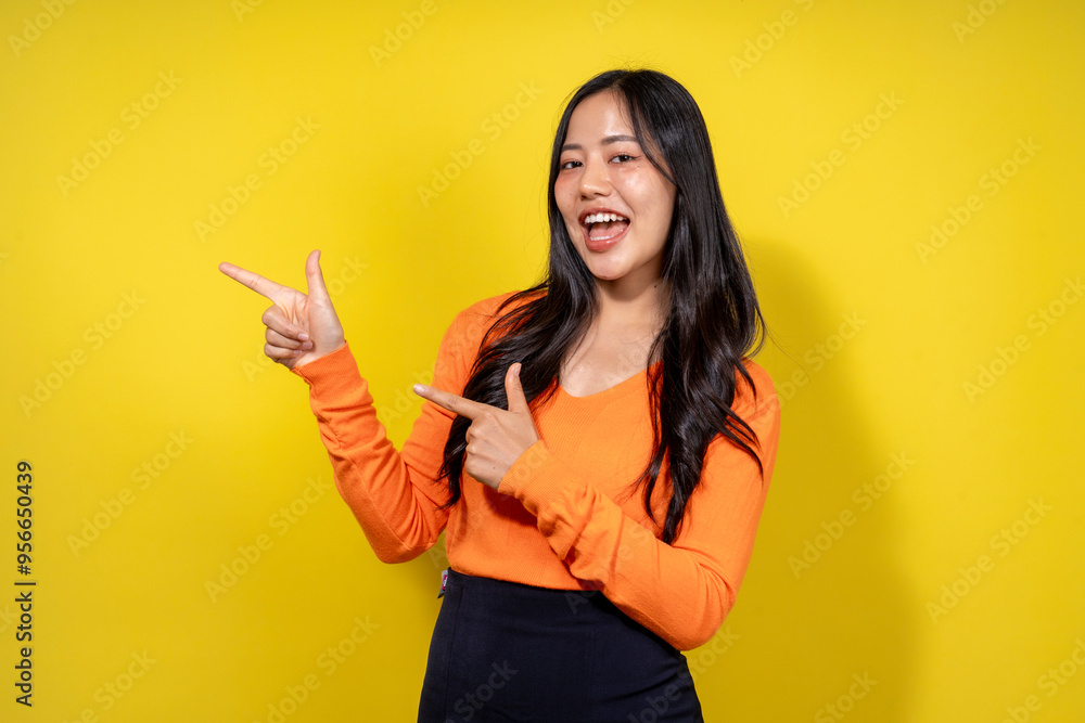 A woman in an orange shirt points to the right A woman in an orange shirt points to the right
