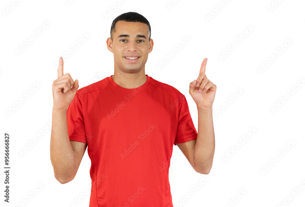 Attractive young man in casual t-shirt pointing up with his fingers isolated over transparent background Attractive young man in casual t-shirt pointing up with his fingers isolated over transparent background