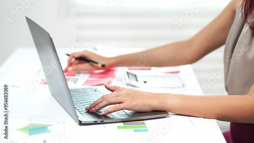 Wallpaper Mural Accountant working on laptop with financial charts Torontodigital.ca