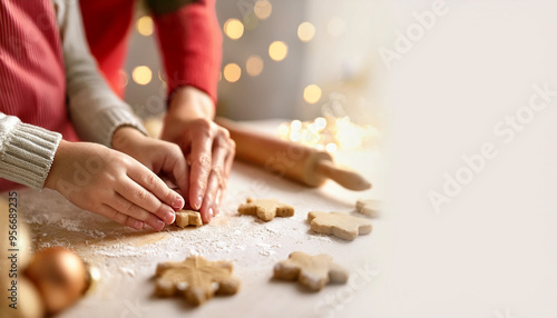 Young family making cookies at home.
